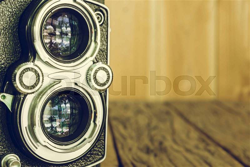 Closeup of apart of old film cameras with free copy space, vintage background, stock photo
