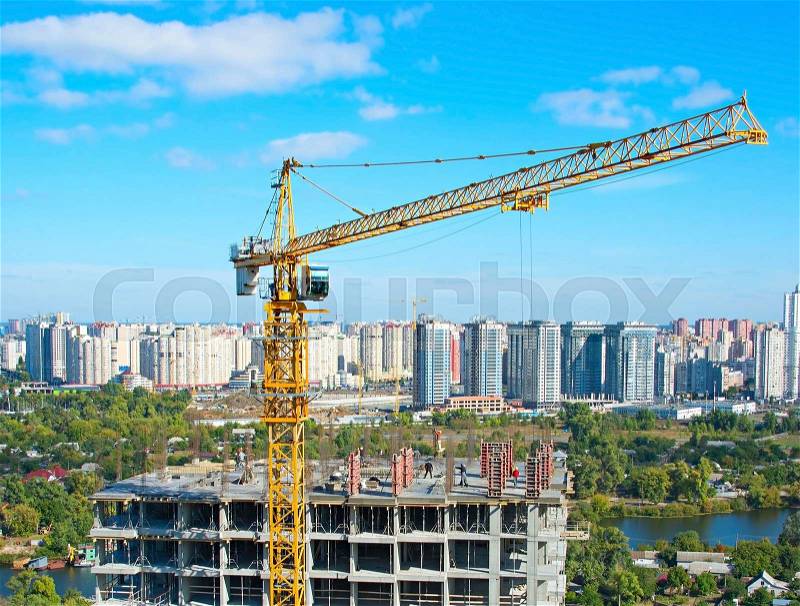 Aerial view of construction site with crane and workers in progress. Kiev, Ukraine, stock photo