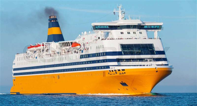 Big yellow passenger ferry ship goes on Mediterranean Sea, stock photo
