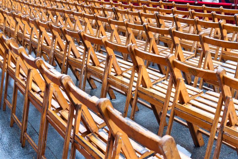 Many empty chair because of rain at event, stock photo