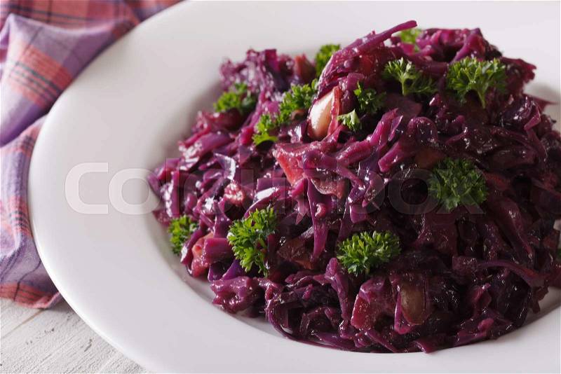 Delicious braised red cabbage close-up on a plate. horizontal , stock photo