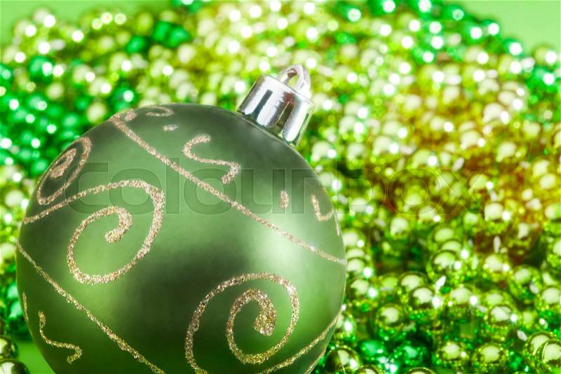 One green Christmas ball with beards closeup, stock photo