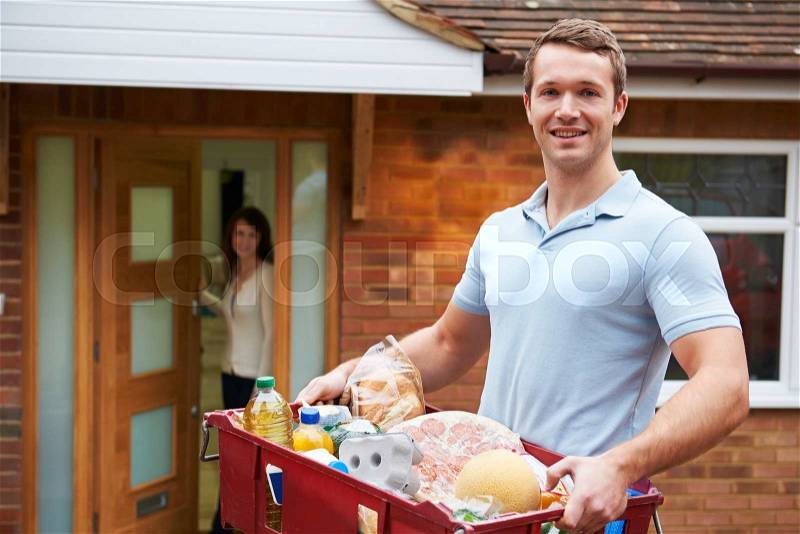 Man Delivering Online Grocery Order, stock photo