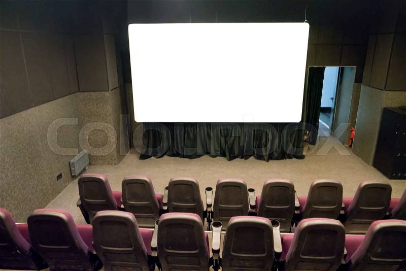Empty stage in the small movie theater with white isolated screen, stock photo