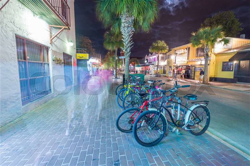KEY WEST, FL -JANUARY 12, 2016: Parked bicycles in city streets. Key West is a preferred tourist attraction in Florida, stock photo
