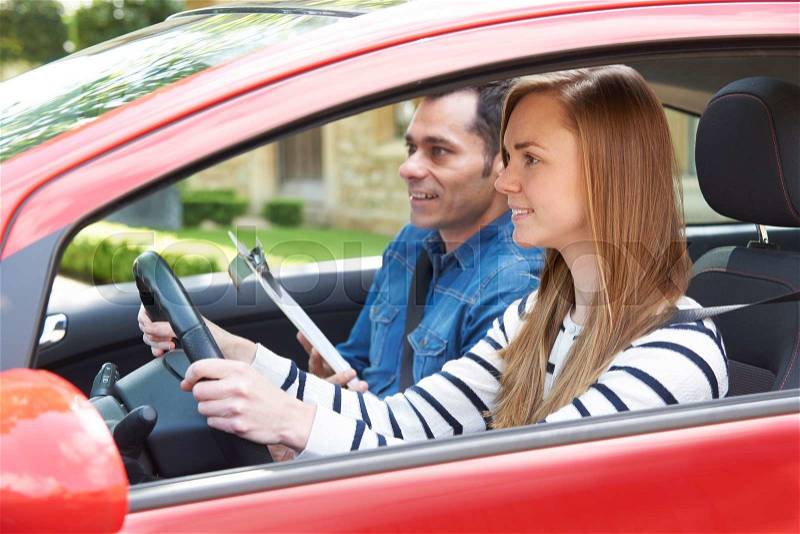 Woman Having Driving Lesson With Instructor, stock photo