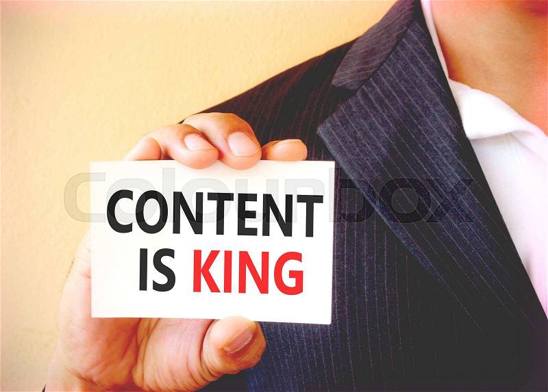 CONTENT IS KING word on the white card shown by a businessman - vintage tone, stock photo