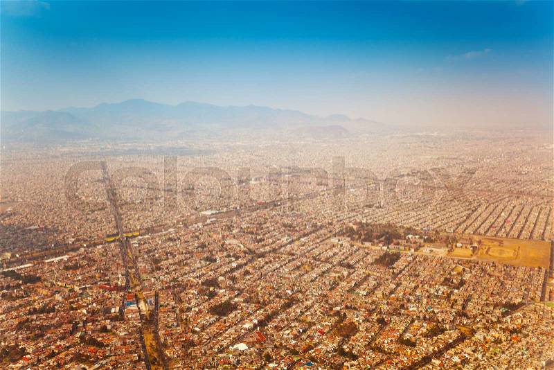 Mexico city outskirts areal view in the morning view from the plane, stock photo