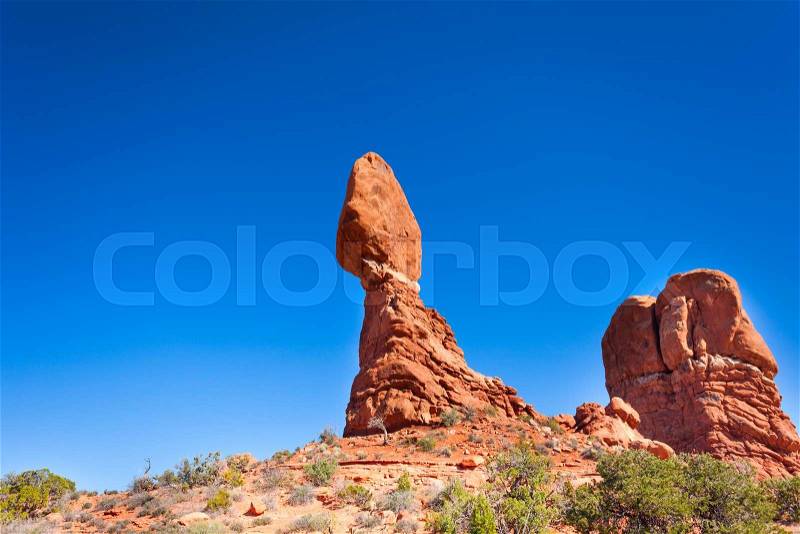 View of balancing rock in Arches National Park, USA during sunny summer day, stock photo