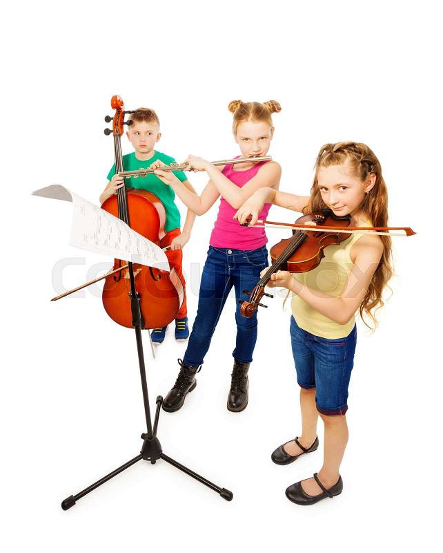 Boy and girls playing on musical instruments together on white background, stock photo