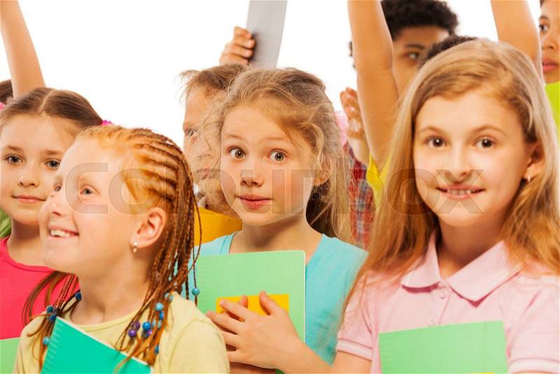 Bunch of school kids standing with textbooks, stock photo