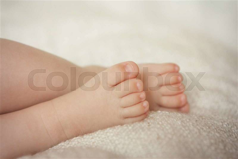 Small delicate little feet, stock photo