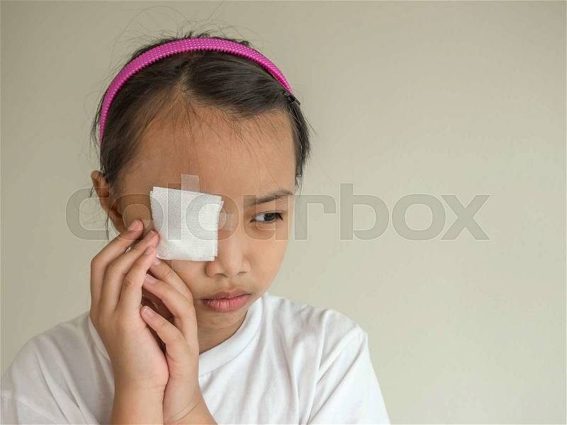 Medicine plaster patch on children injury wound eye, stock photo