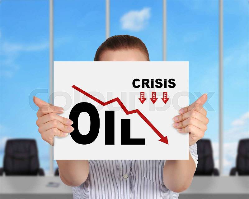 Businesswoman in modern office showing paper with drawing oil crisis chart, stock photo