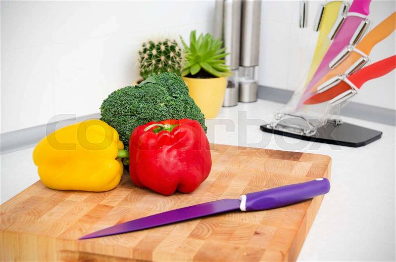 Fresh vegetables on a chopping board in the kitchen, stock photo