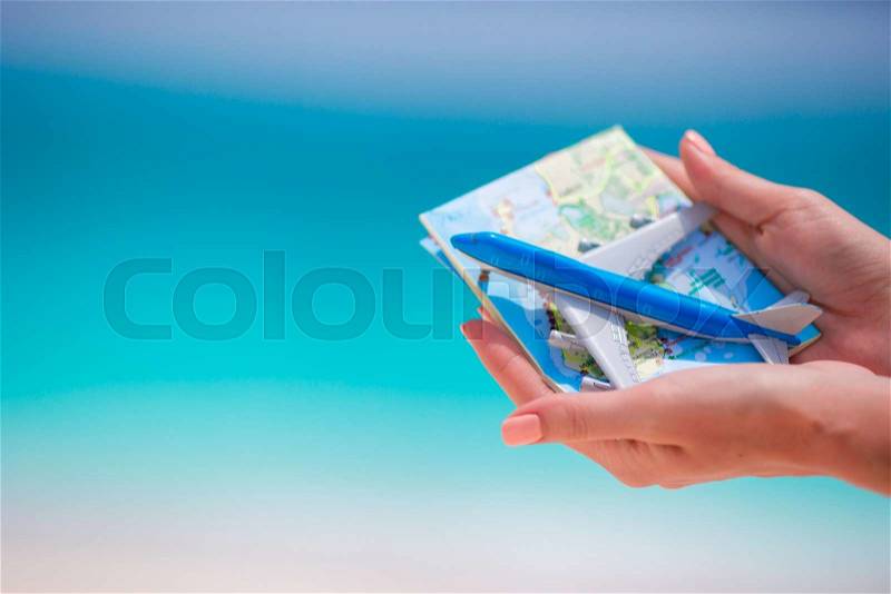 Closeup of map and toy airplane background the sea, stock photo
