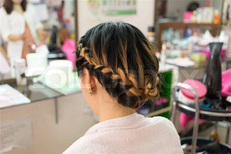 Long braid creative brown hair style in salon beauty, stock photo