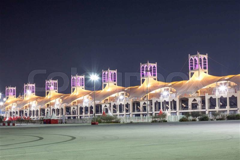BAHRAIN - NOV 16: Grandstand at the Bahrain International Circuit illuminated at night. November 16, 2015 in Bahrain, Middle East, stock photo