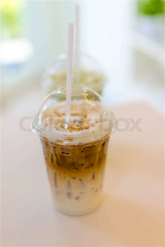 Thai milk ice tea in Plastic glass, stock photo