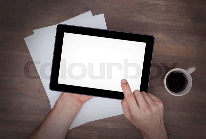 Tablet touch computer gadget on wooden table, vintage look, stock photo