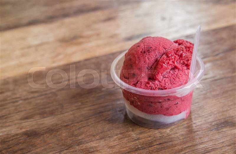 Red ice cream bowl on tabel, stock photo