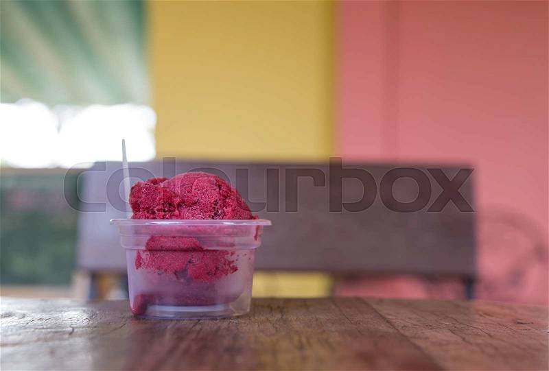 Red ice cream bowl on tabel, stock photo