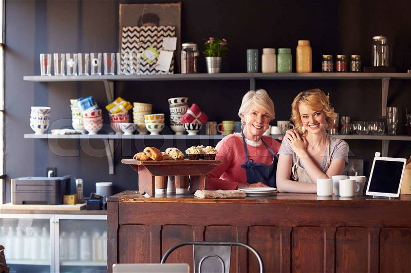 Portrait Of Staff At Coffee Shop Standing Behind Counter, stock photo