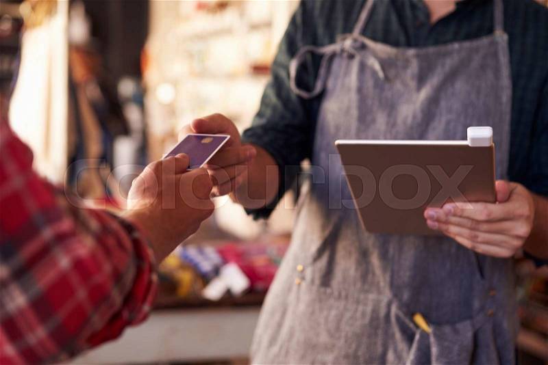 Credit Card Reading Device Attached To Digital Tablet, stock photo