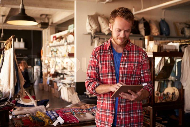 Male Owner Of Gift Store With Digital Tablet, stock photo