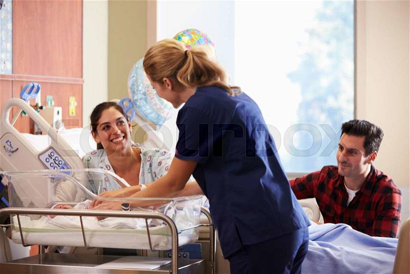 Family And Nurse With New Born Baby In Post Natal Department, stock photo