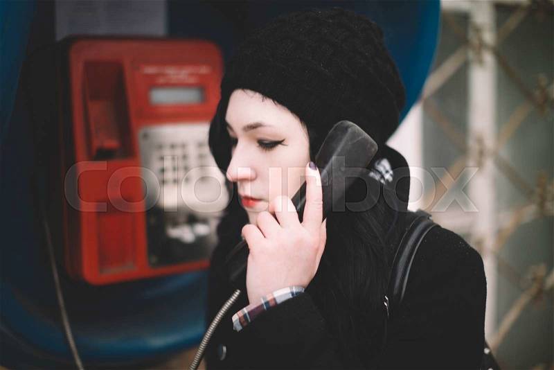 Portrait of young woman on the street( great DOF) , stock photo