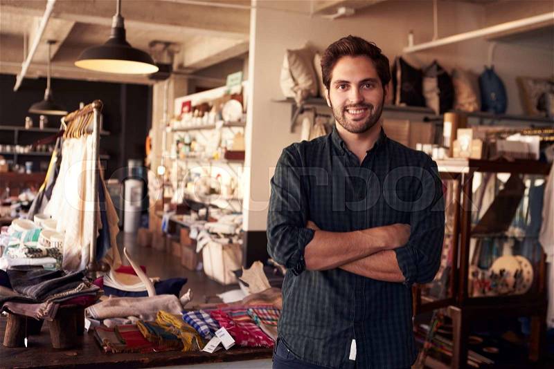 Portrait Of Male Owner Standing In Gift Store, stock photo