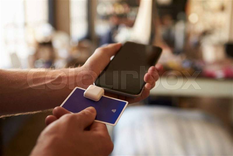 Credit Card Reading Device Attached To Mobile Phone, stock photo