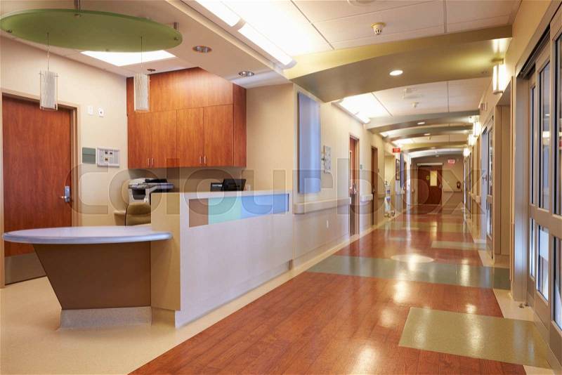 Empty Nurses Station And Corridor In Modern Hospital, stock photo