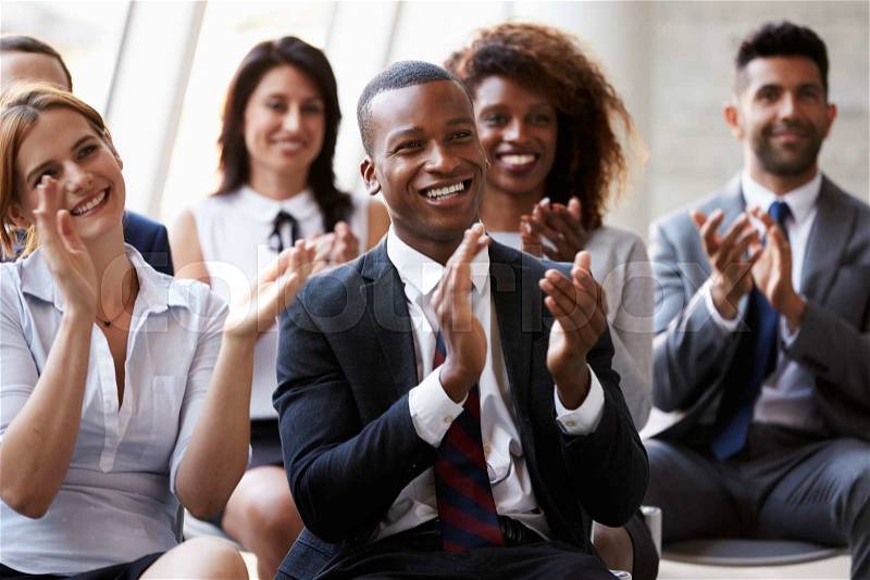 Audience Applauding Speaker At Business Conference, stock photo