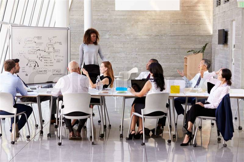 African American Businesswoman Leads Boardroom Meeting, stock photo