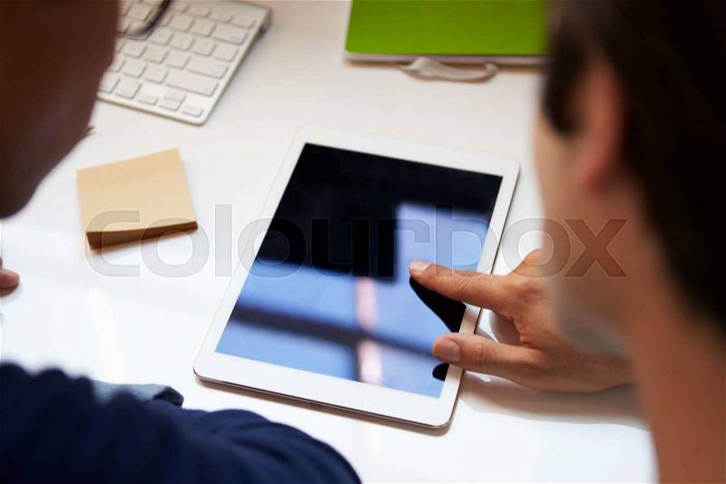 Close Up Of Businesspeople With Digital Tablet In Meeting, stock photo