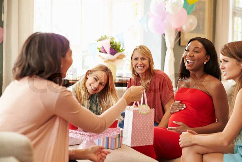 Group Of Female Friends Meeting For Baby Shower At Home, stock photo