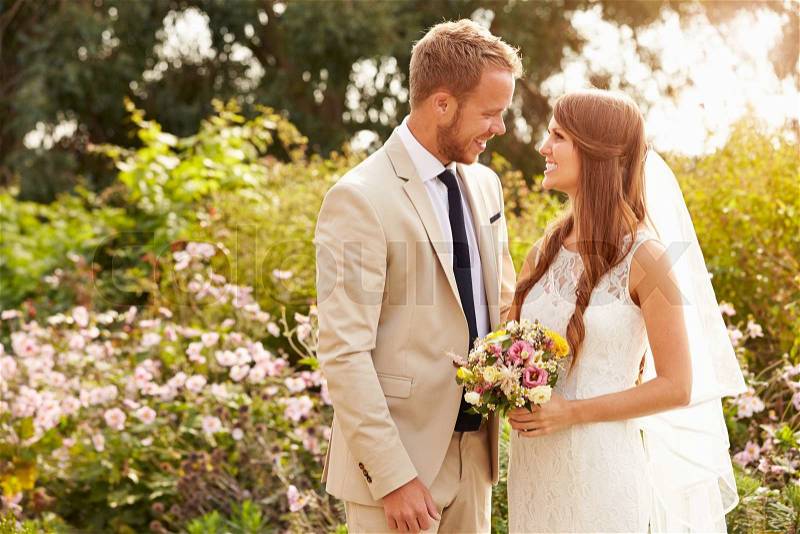 Romantic Young Couple Getting Married Outdoors, stock photo