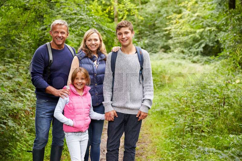 Portrait Of Family On Walk Through Beautiful Countryside, stock photo