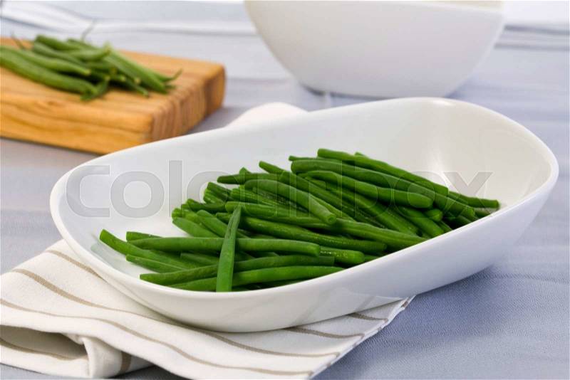 French green beans in modern white bowl, stock photo