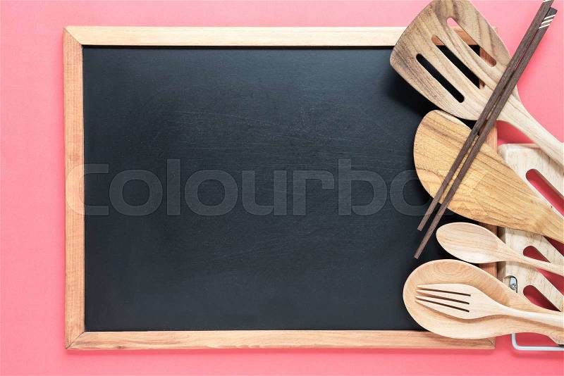 Retro kitchen utensils with empty blackboard on pink background. Food conceptual, stock photo