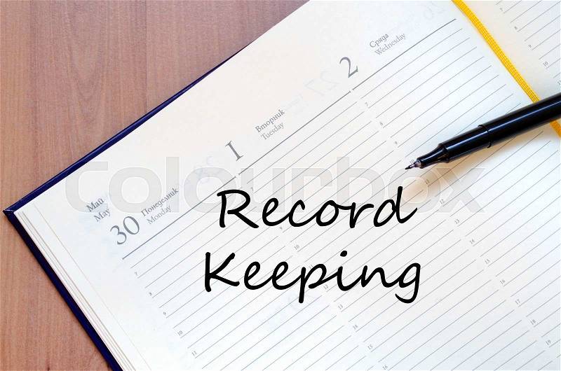 Record keeping text concept write on notebook with pen, stock photo