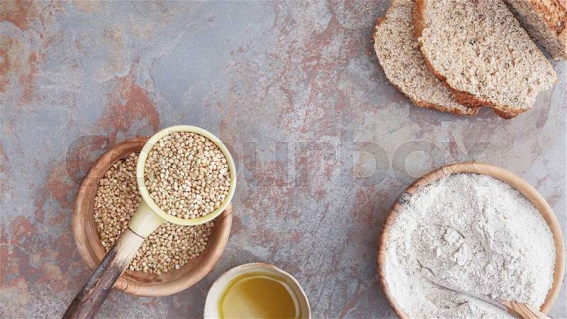 Buckwheat. Still life with buckwheat bread, flour and grains. Top view, blank space, stock photo