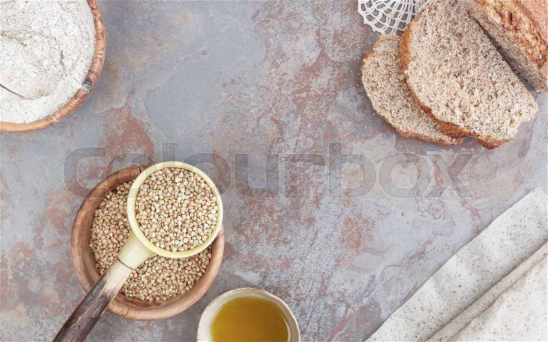 Baking with buckwheat. Still life with buckwheat bread, pastry, flour and grains. Top view, blank space, stock photo