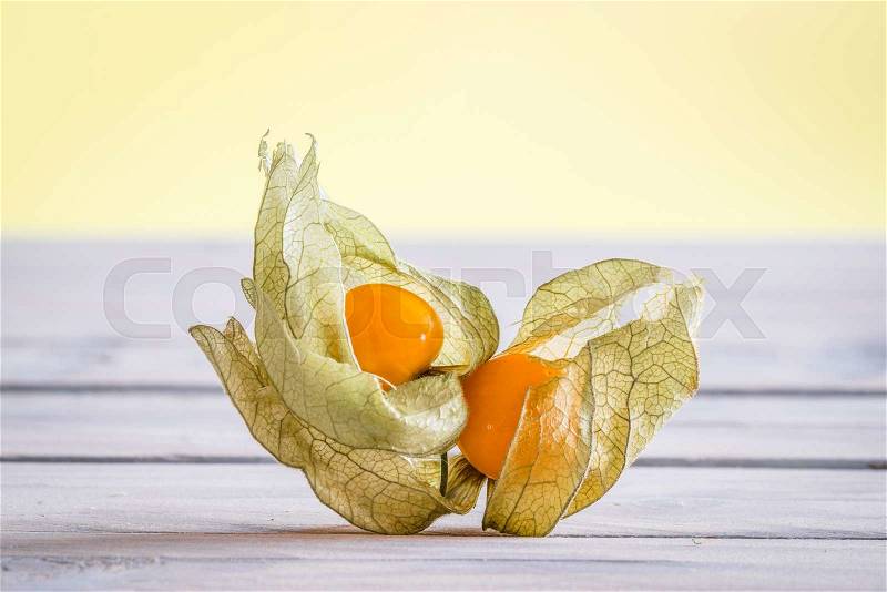 Cape gooseberries on a wooden desk in the spring, stock photo