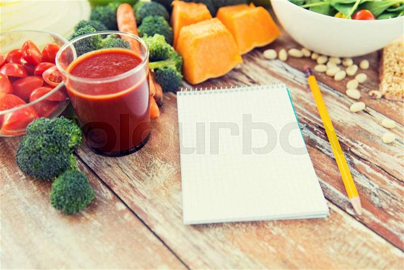 Healthy eating, vegetarian food, advertisement and culinary concept - close up of ripe vegetables and notebook with pencil on wooden table, stock photo