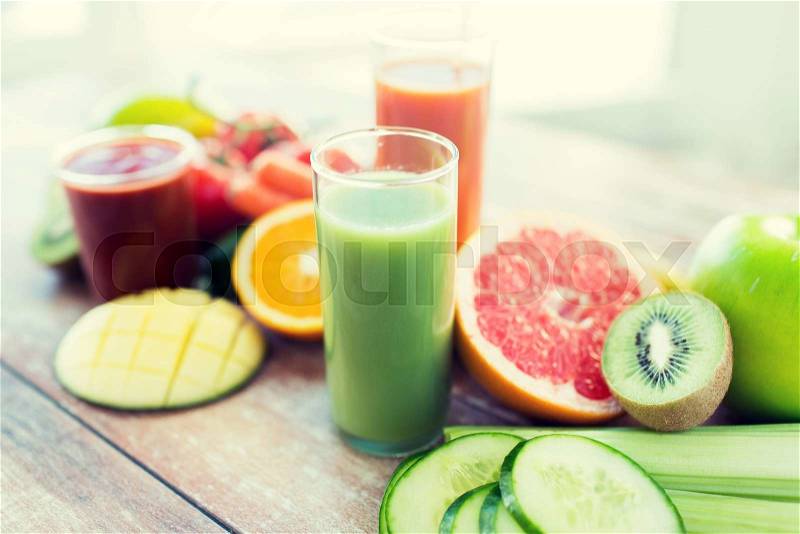 Healthy eating, food and diet concept- close up of fresh juice glass and fruits on table, stock photo