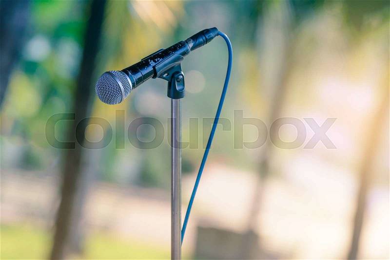 Black color microphone in outdoor events, stock photo