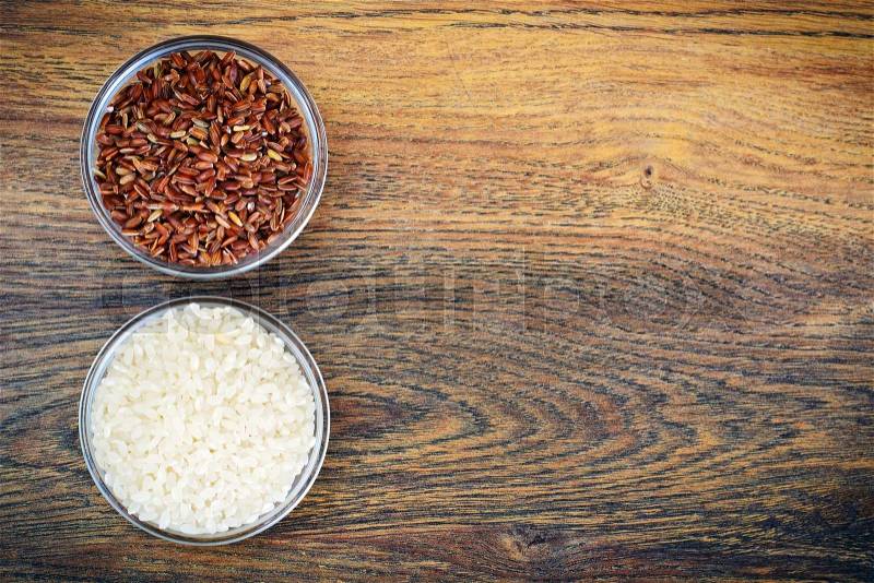 White and Red Rice in Glass Cup on Wooden Background Studio Photo, stock photo